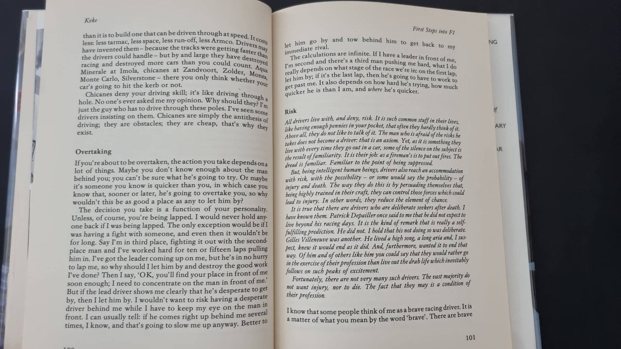 Open book with two pages of small printed text