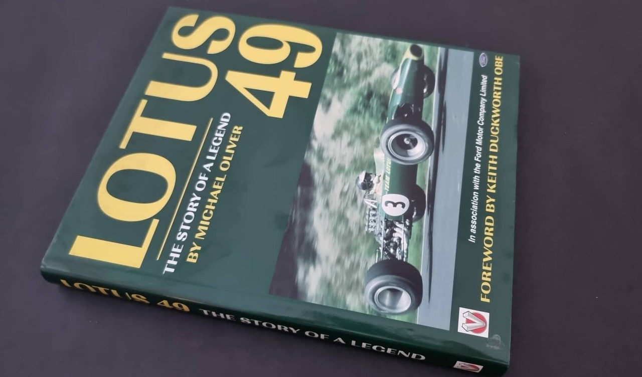 Lotus 49 racing book cover with blue-green design and car photo