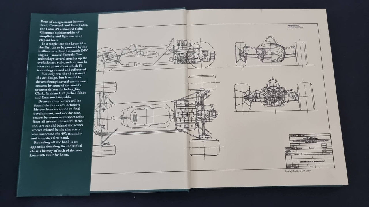 Opened Lotus 49 book with detailed engineering sketch diagrams on white pages