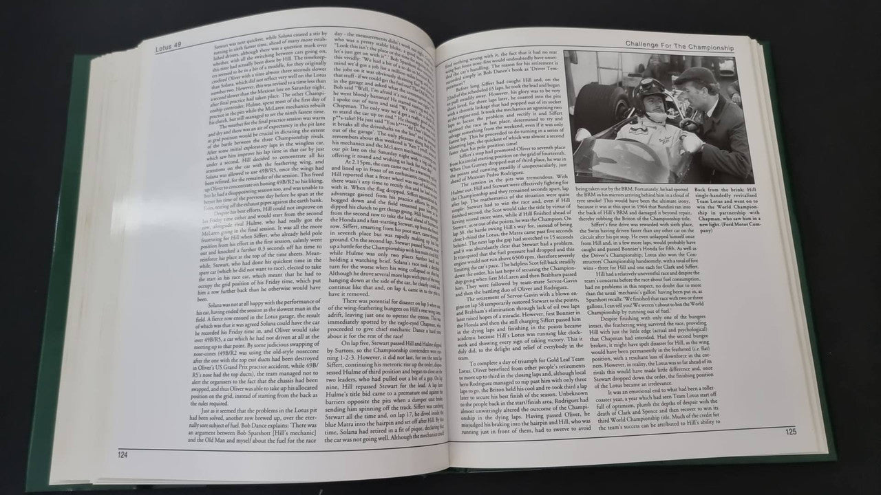 Open motorsport history book with black-and-white people photo inset and text