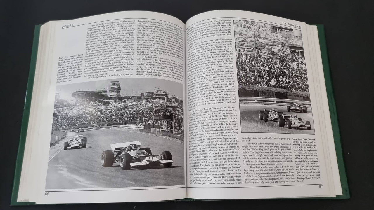 Open motorsport history book with track photo spread and crowd scene images