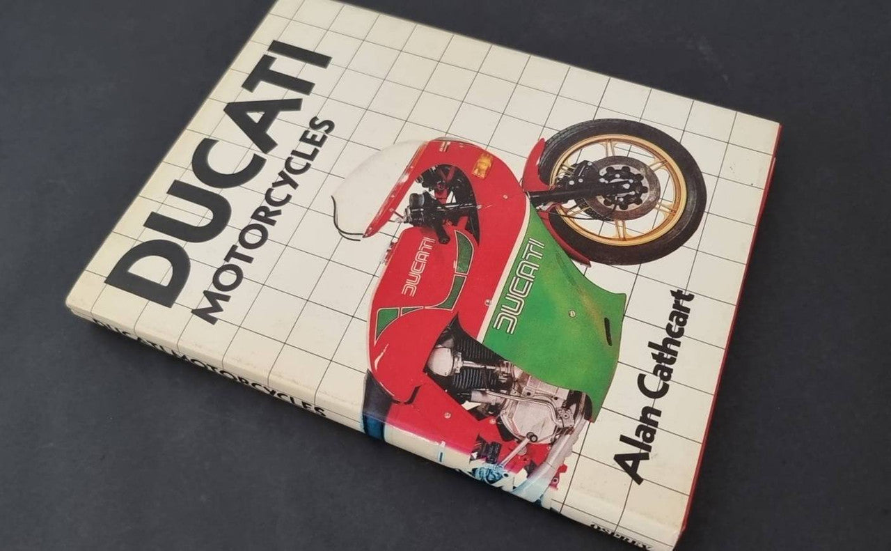 Motorcycle book cover with Ducati graphics and Alan Cathcart author text