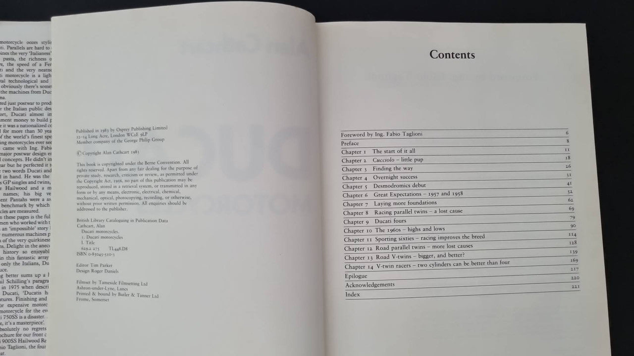 Open motorcycle book with Contents page and columned reading list