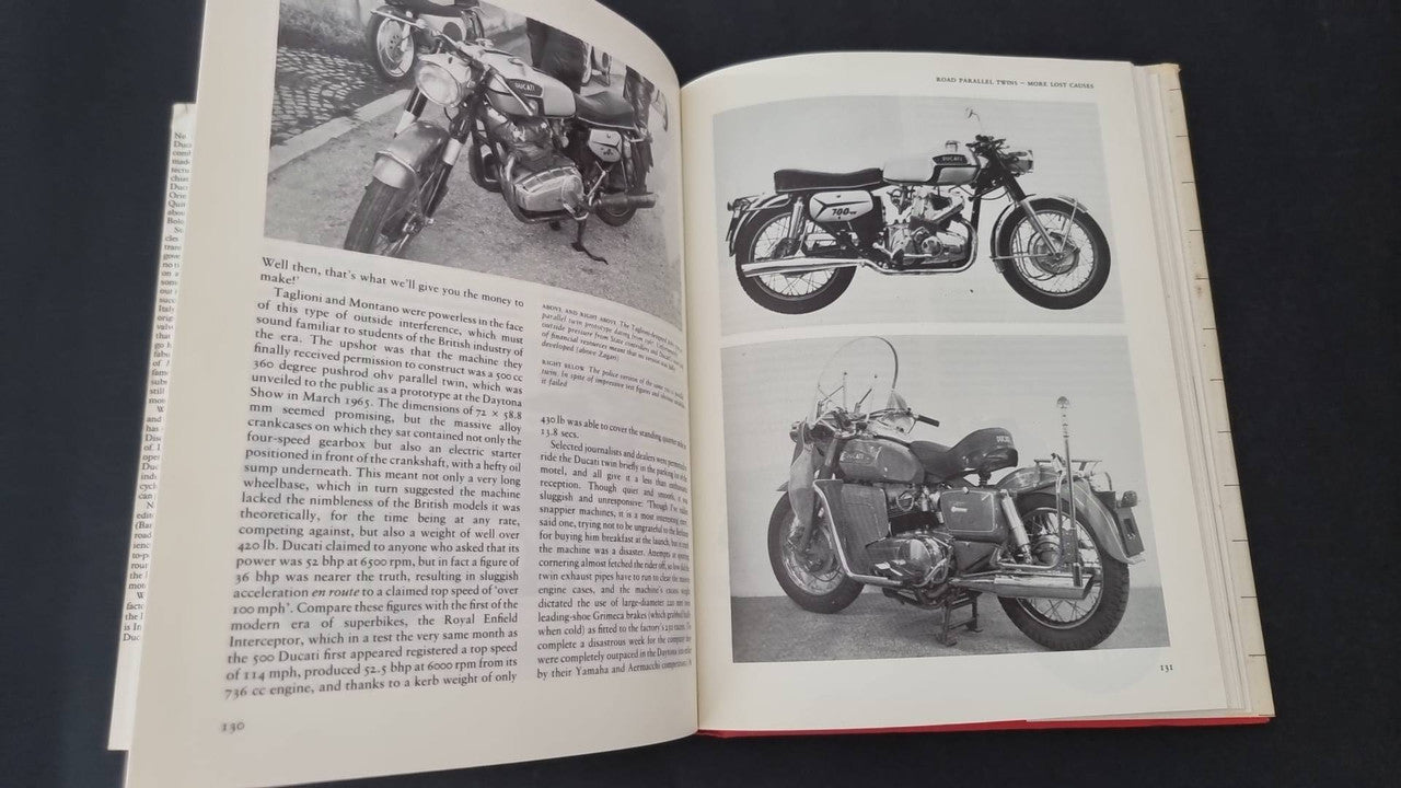Open motorcycle book with black-and-white motorcycle photos on facing pages