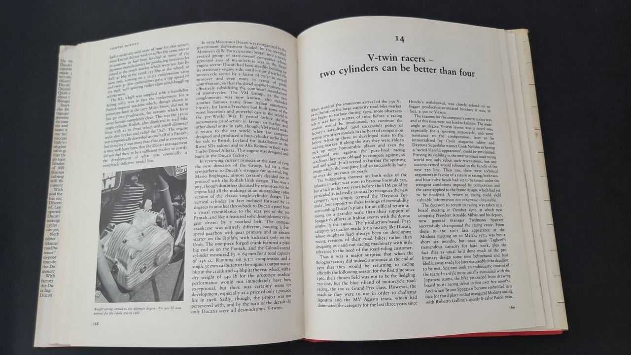 Open vintage book spread with dense text and black-and-white rider motorcycle photo