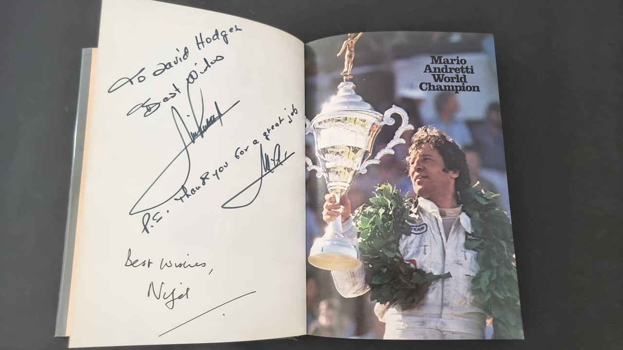 Signed racing book with handwritten autograph page and trophy photo