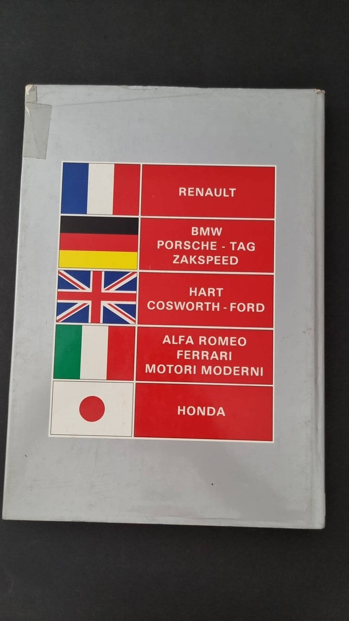 Hardcover book cover with red and blue grid of racing brand logos and flags