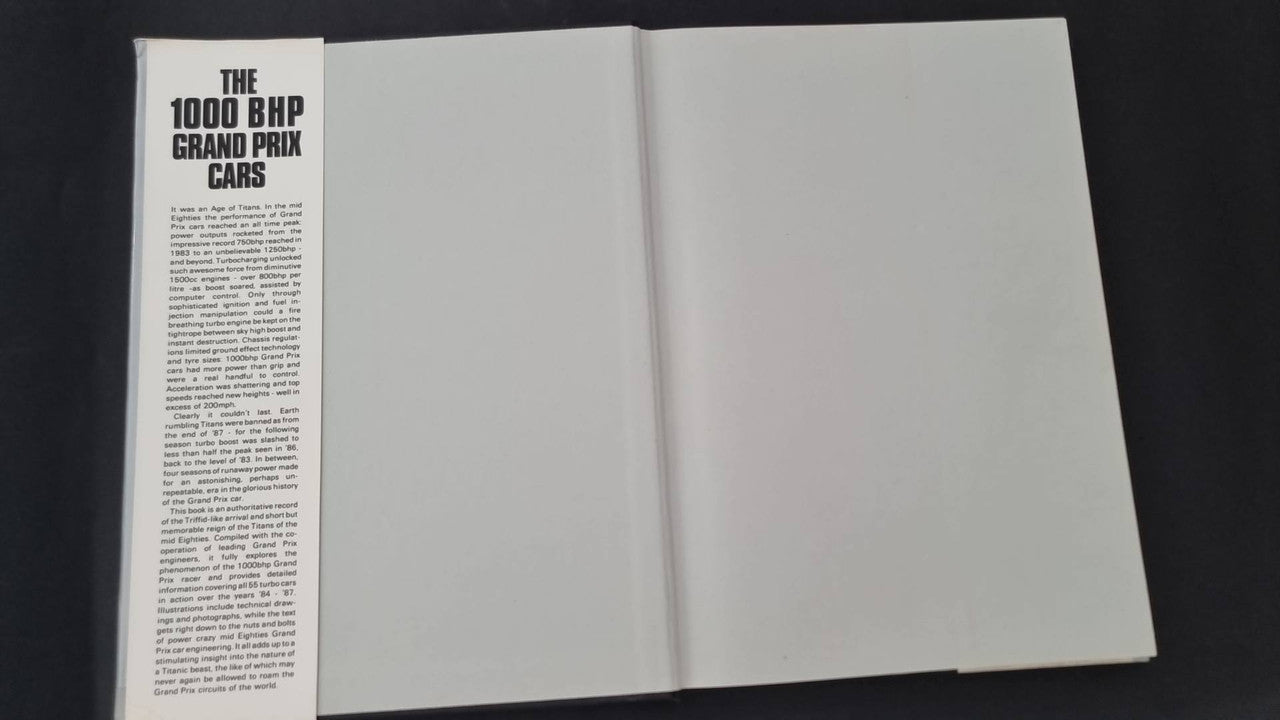 Open book with left page showing title and paragraph text, right page blank
