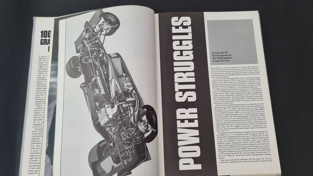 Open book spread with motorcycle diagram image and tall vertical side heading