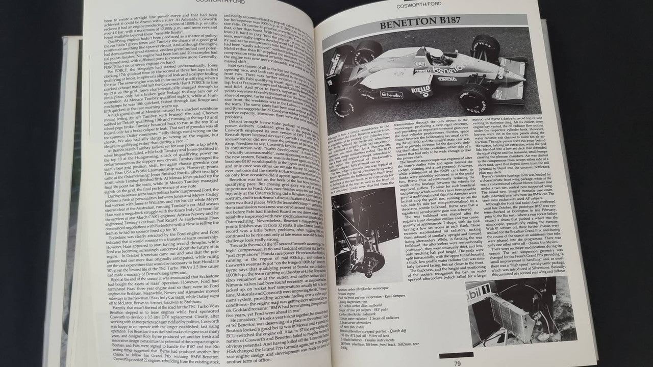 Opened motorsport book with Benetton car photo, text columns, and smaller images
