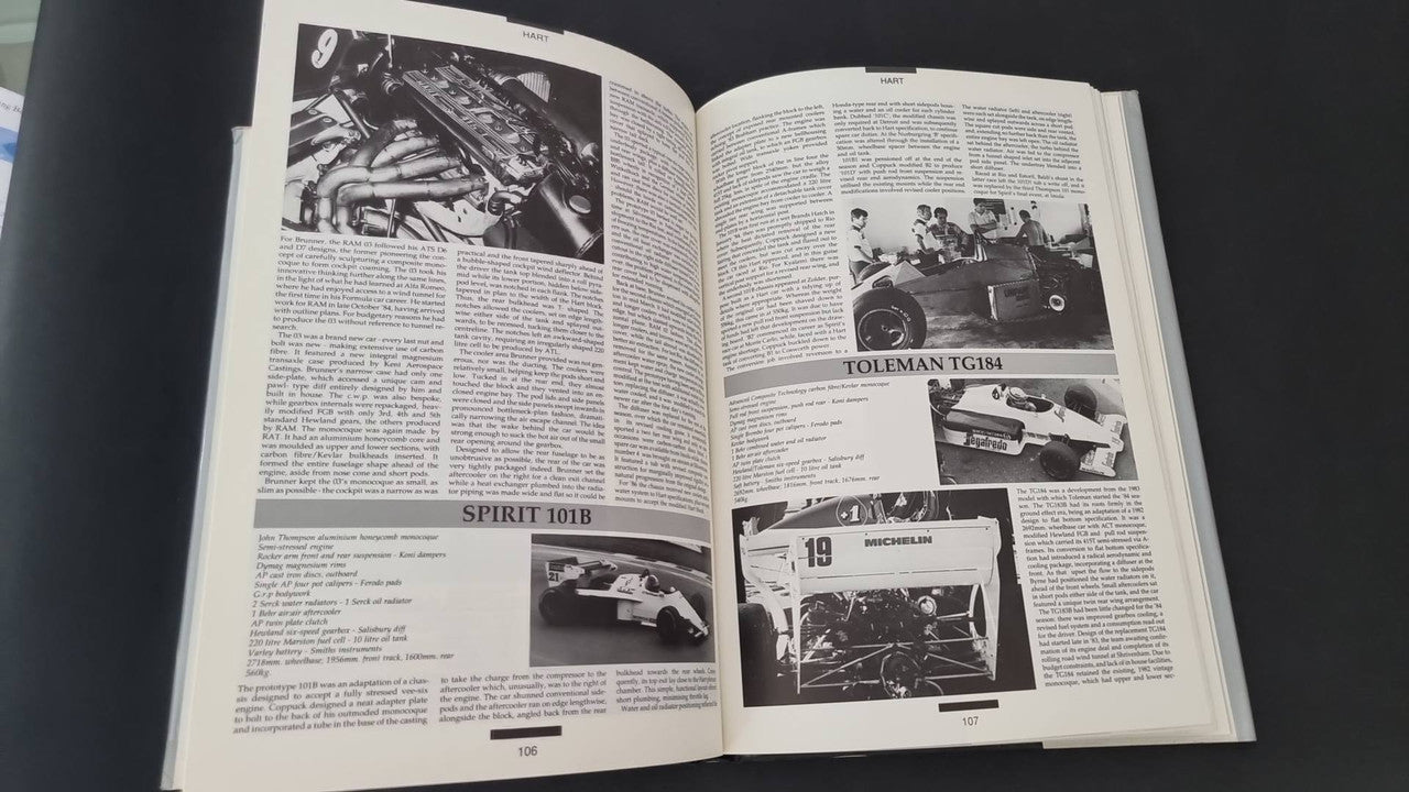 Open book spread with black-and-white racing photos and dense caption text