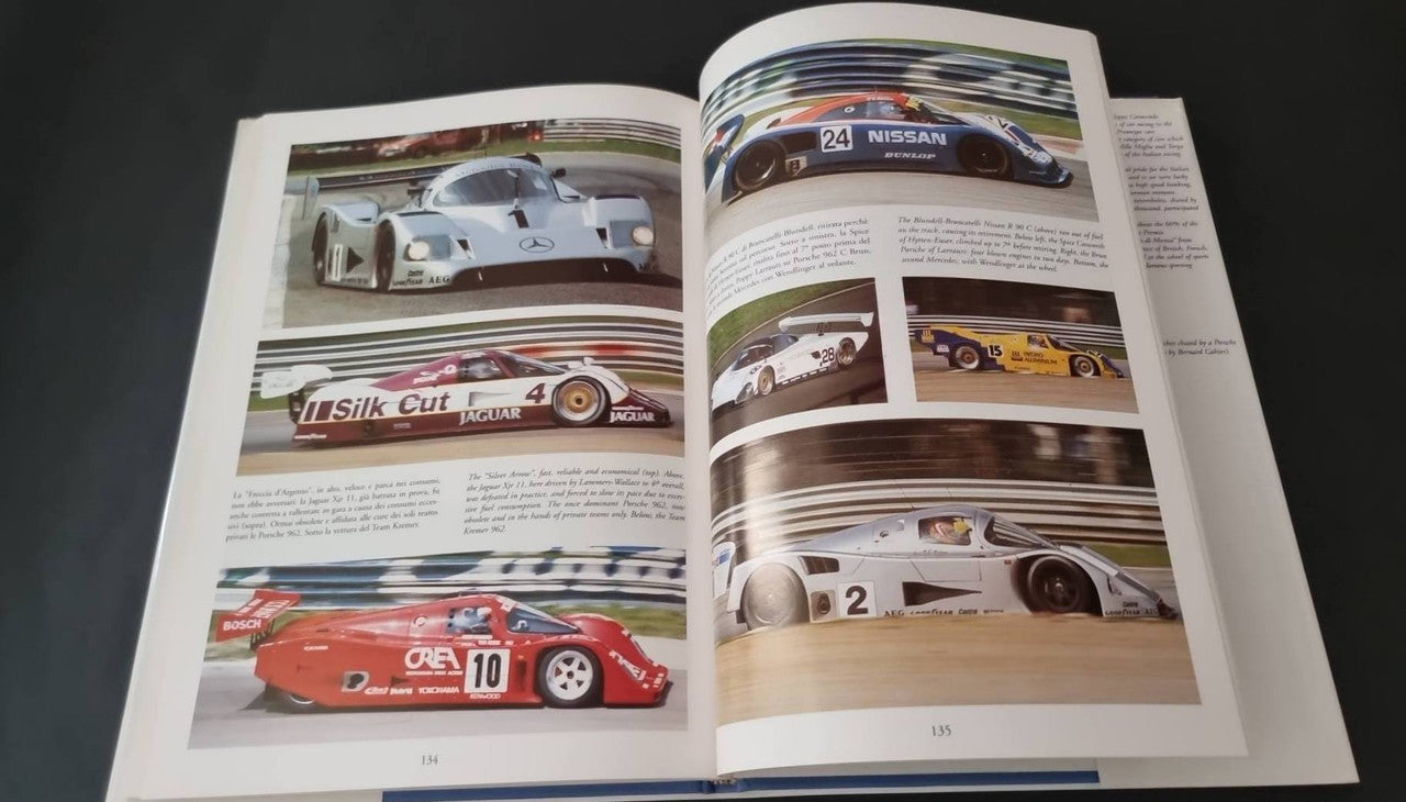 Open motorsport book spread with prototype car photos and race results text