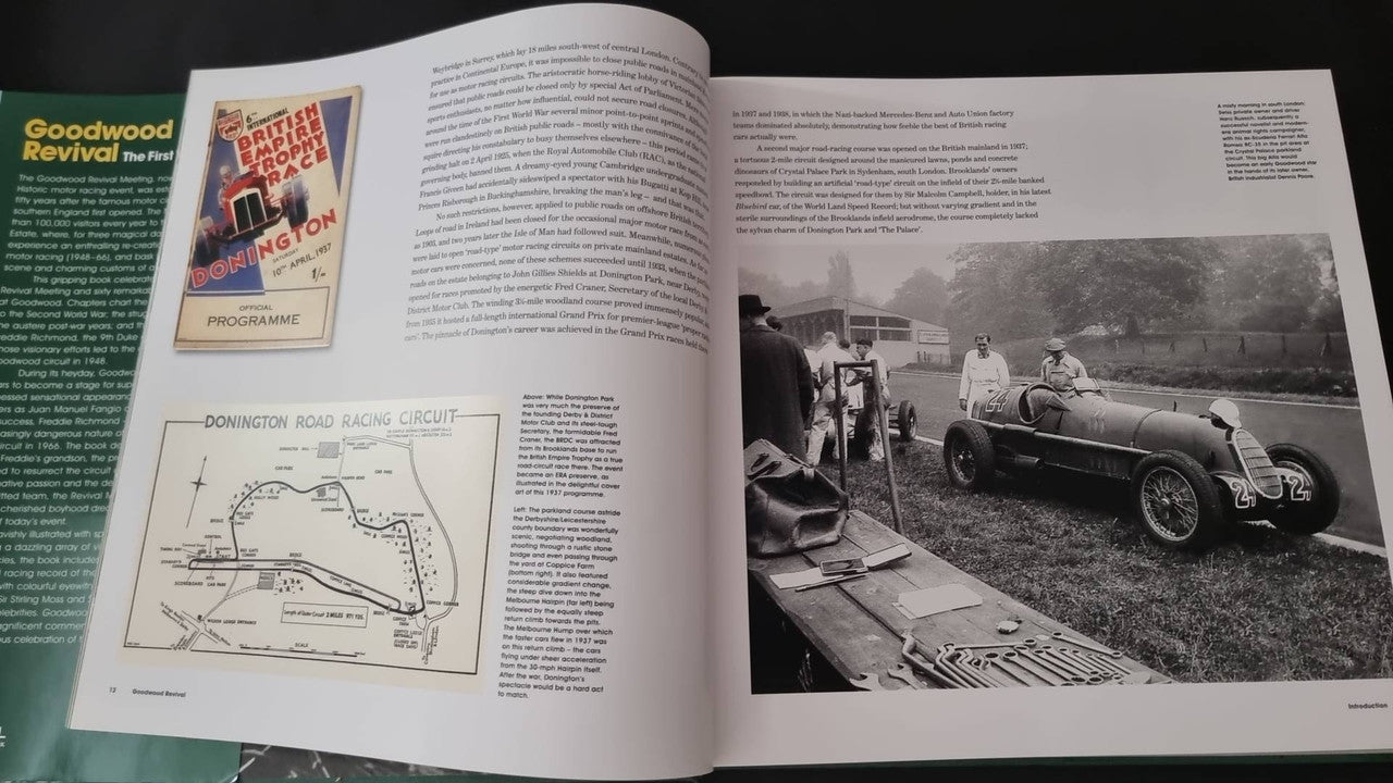 Open hardcover book with diagrams, photos, and long-form text pages