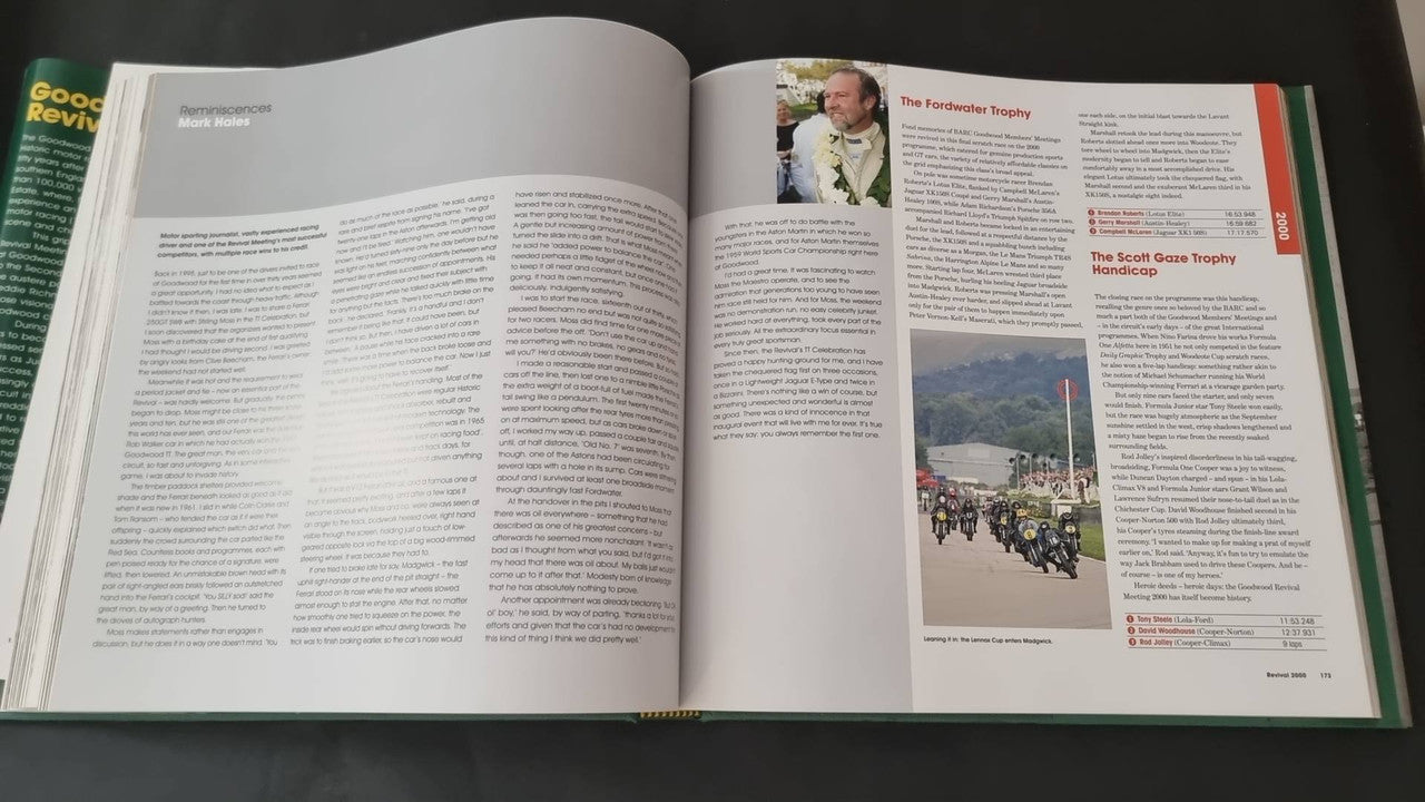 Open hardcover book with printed text and small event photo panels