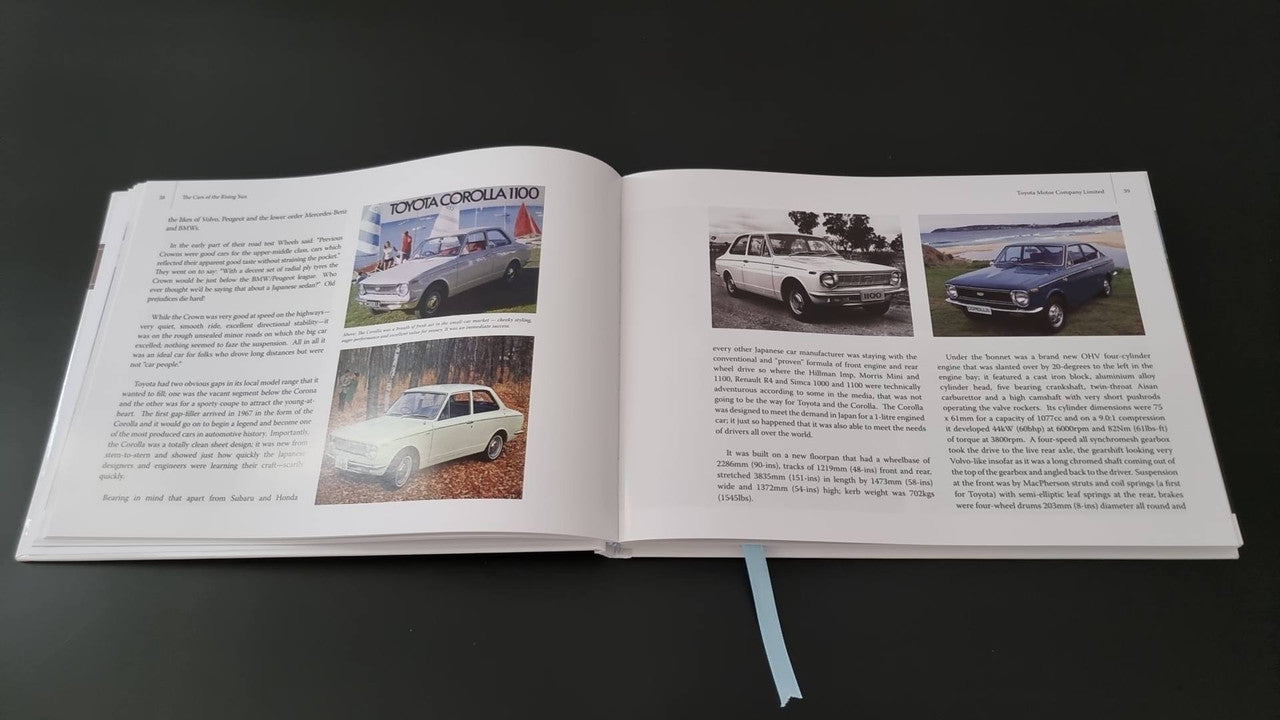 Automotive photo book by Gavin Farmer, open pages with color car photos and body text