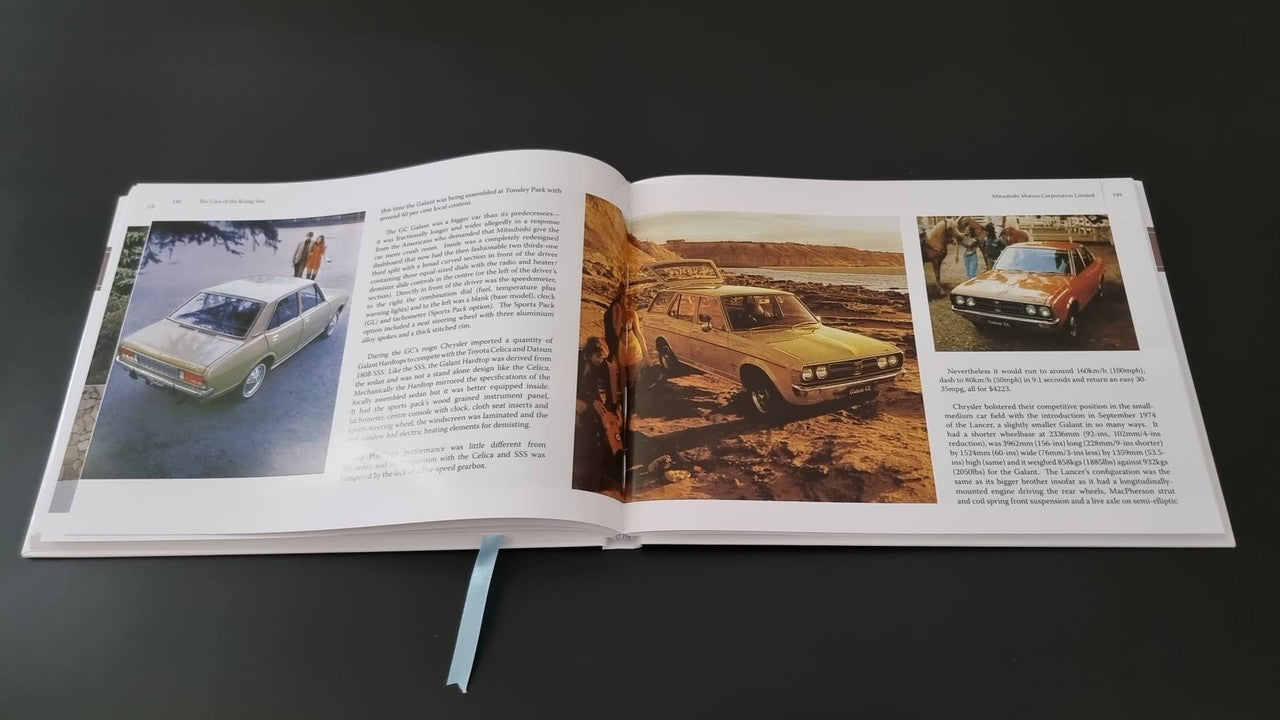 Book open to a car photo spread with paragraphs and vehicle images