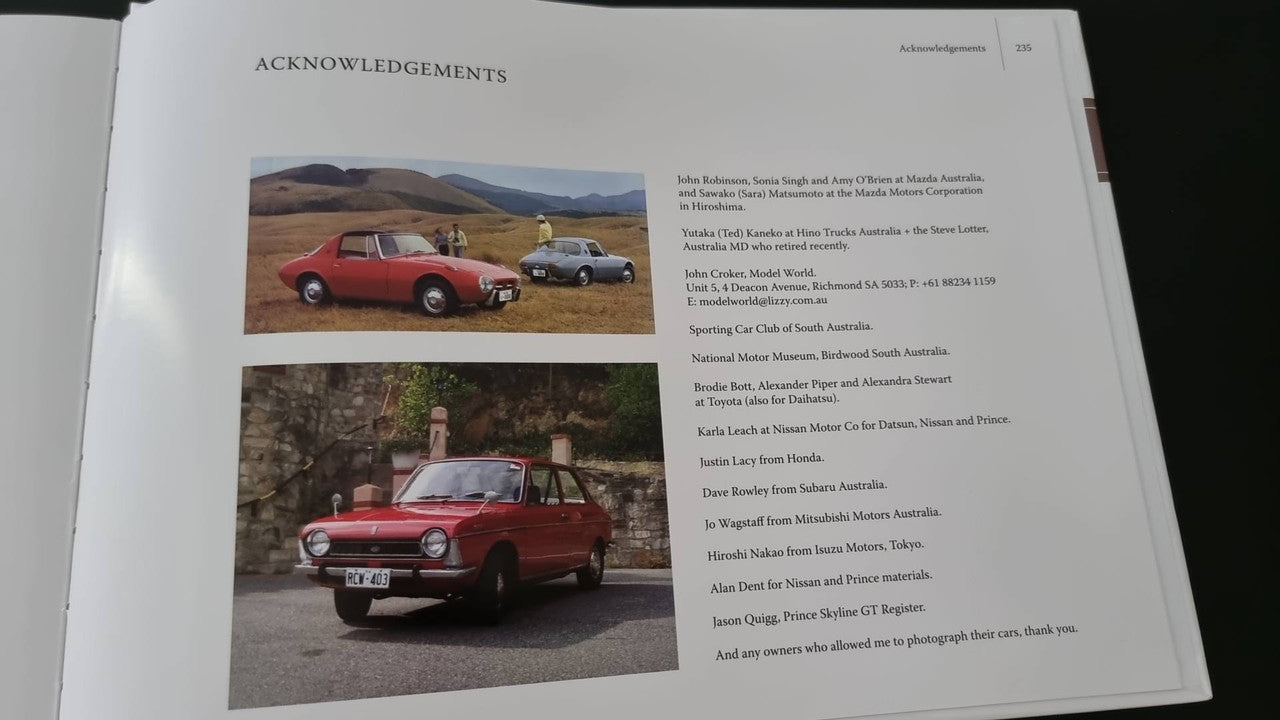 Book page showing acknowledgements and a red pickup truck photo
