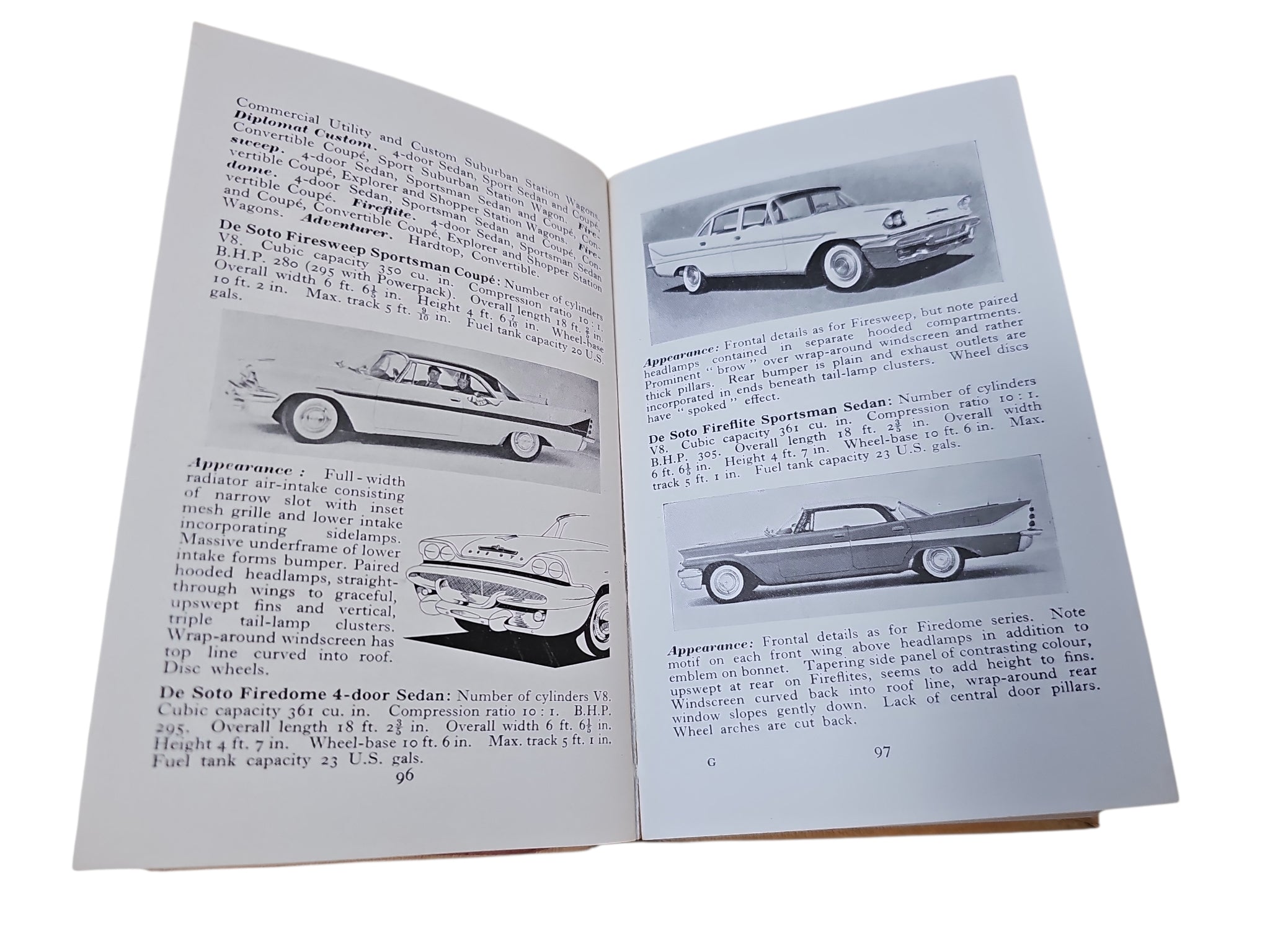 Open automobiles book with car diagrams and paragraphs on both pages