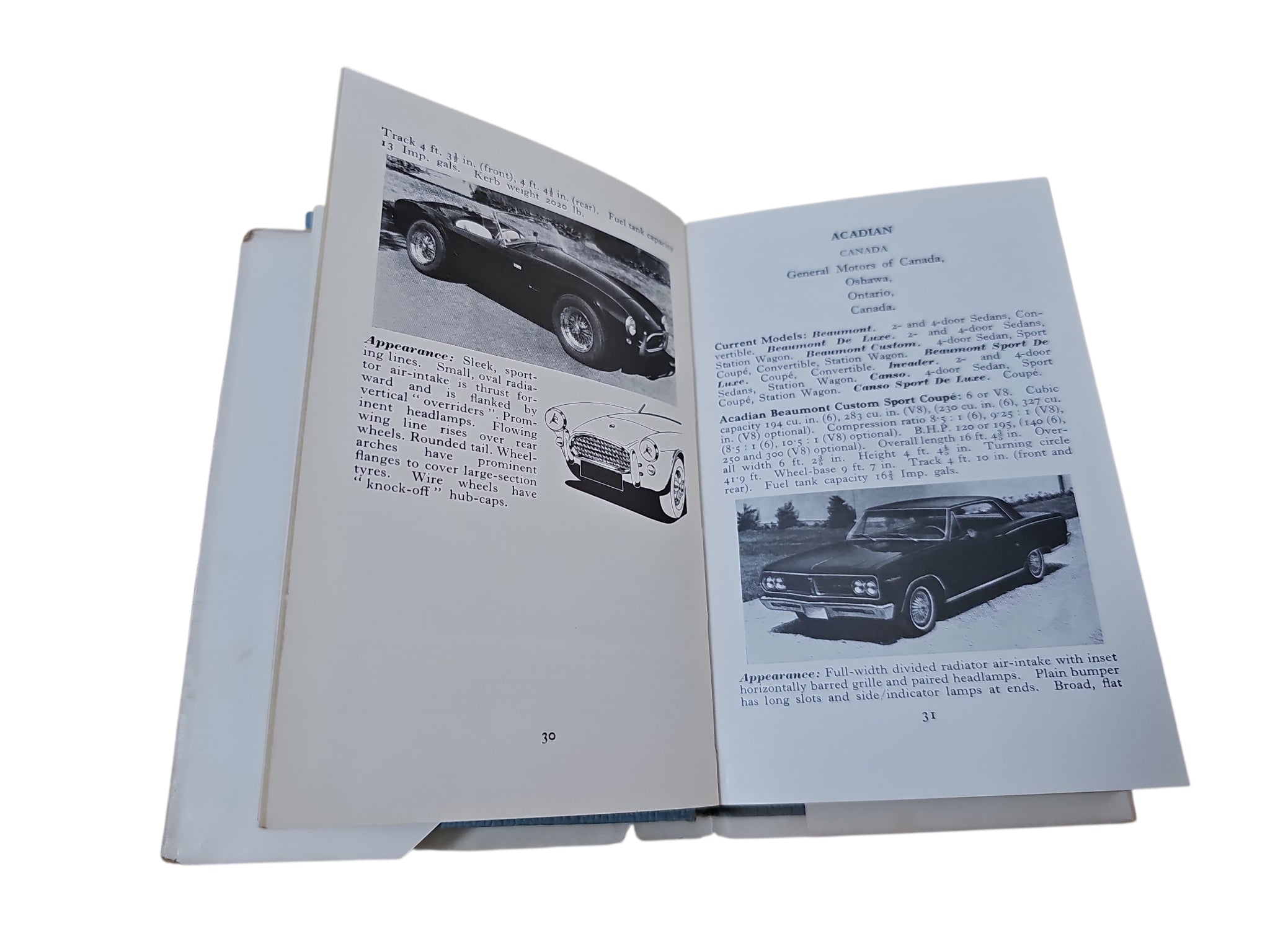 Open book with black-and-white car photos and printed captions