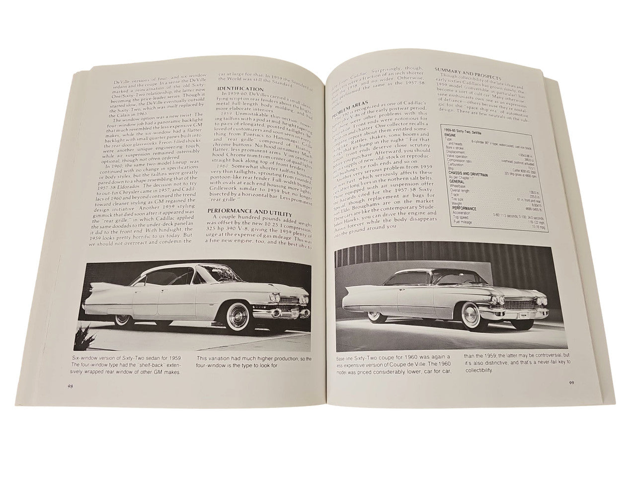 Vintage auto buyer's guide book open to two pages with black-and-white car photos