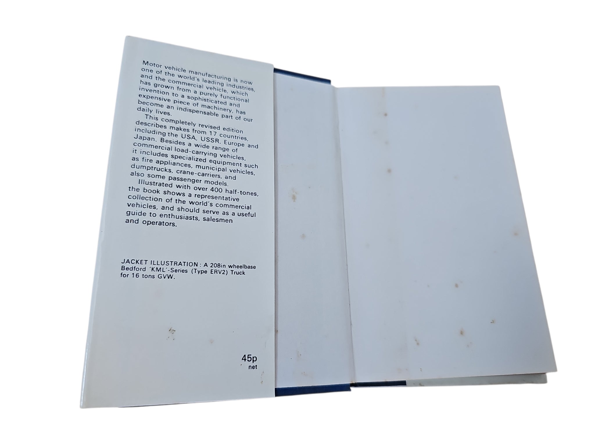 Book interior pages with printed text and a mostly blank facing page