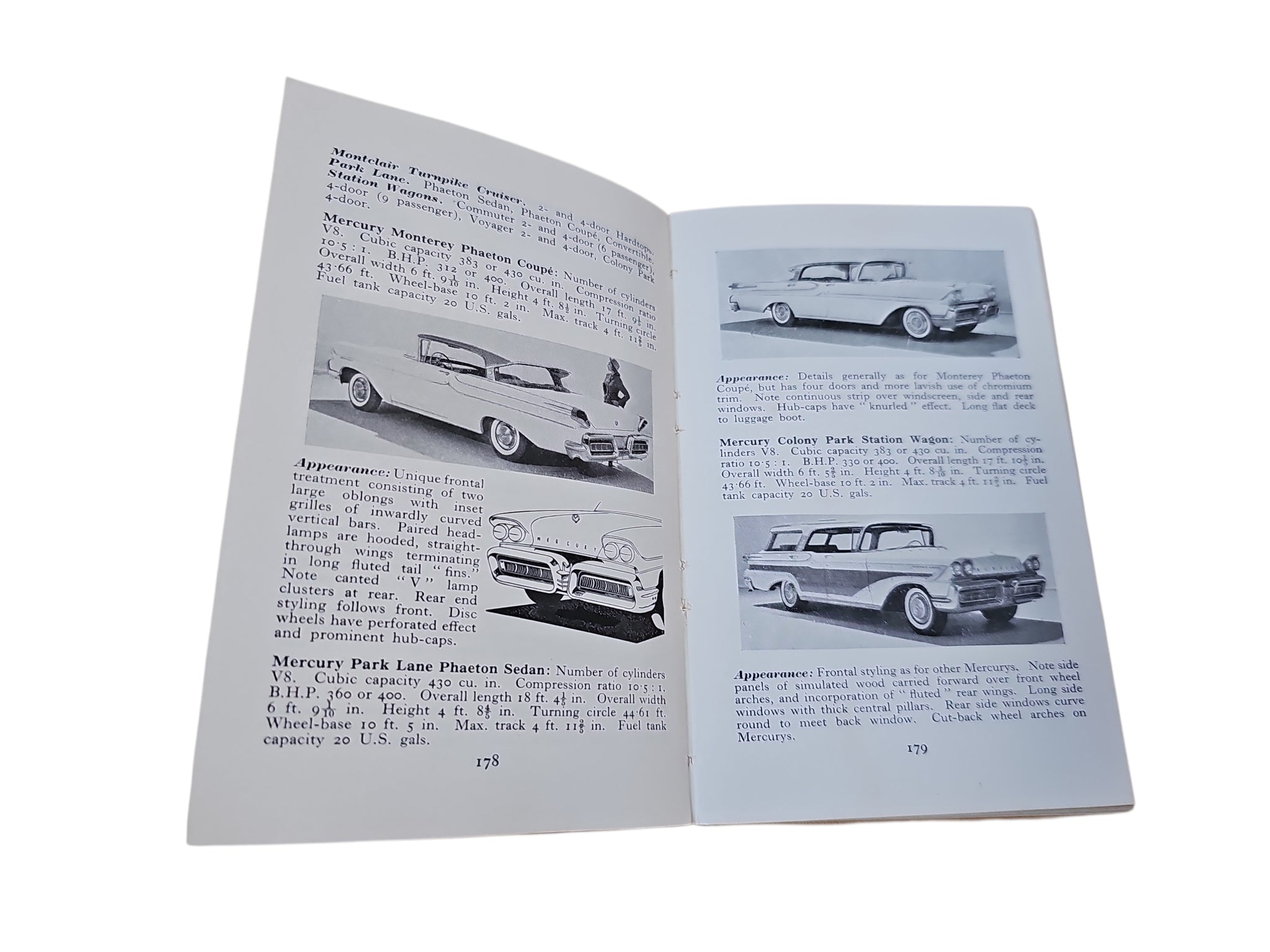 Open automobiles book with multiple black-and-white car images on pages