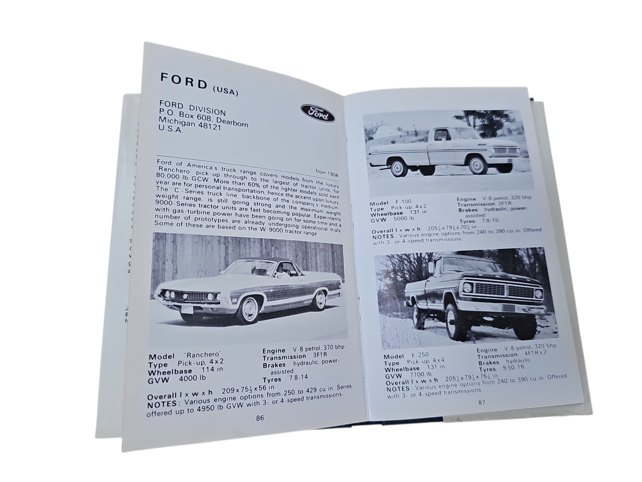 Open book pages with vehicle specifications and photos, including a pickup truck and van