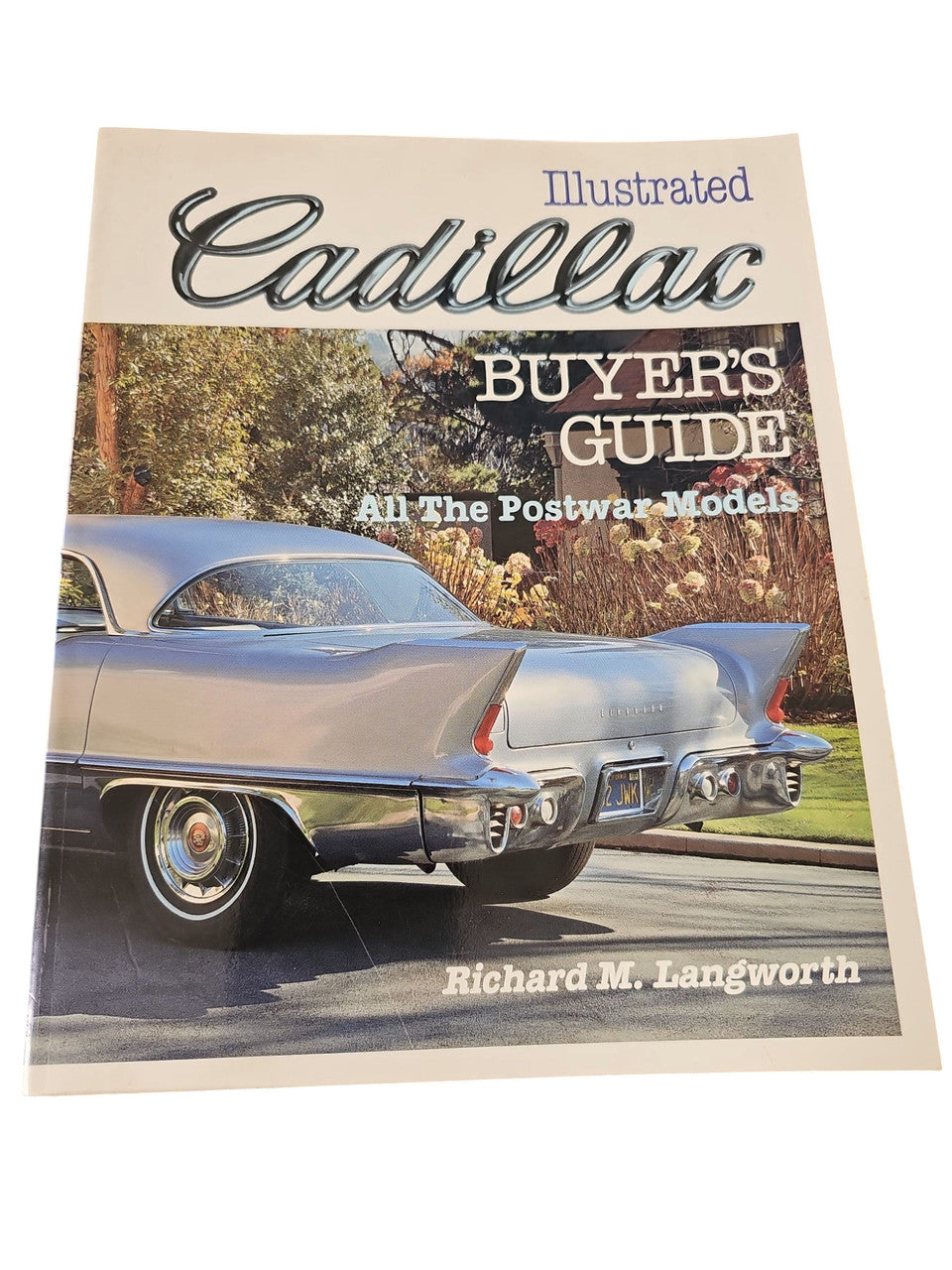 Cadillac illustrated buyer's guide book with vintage car photo on cover