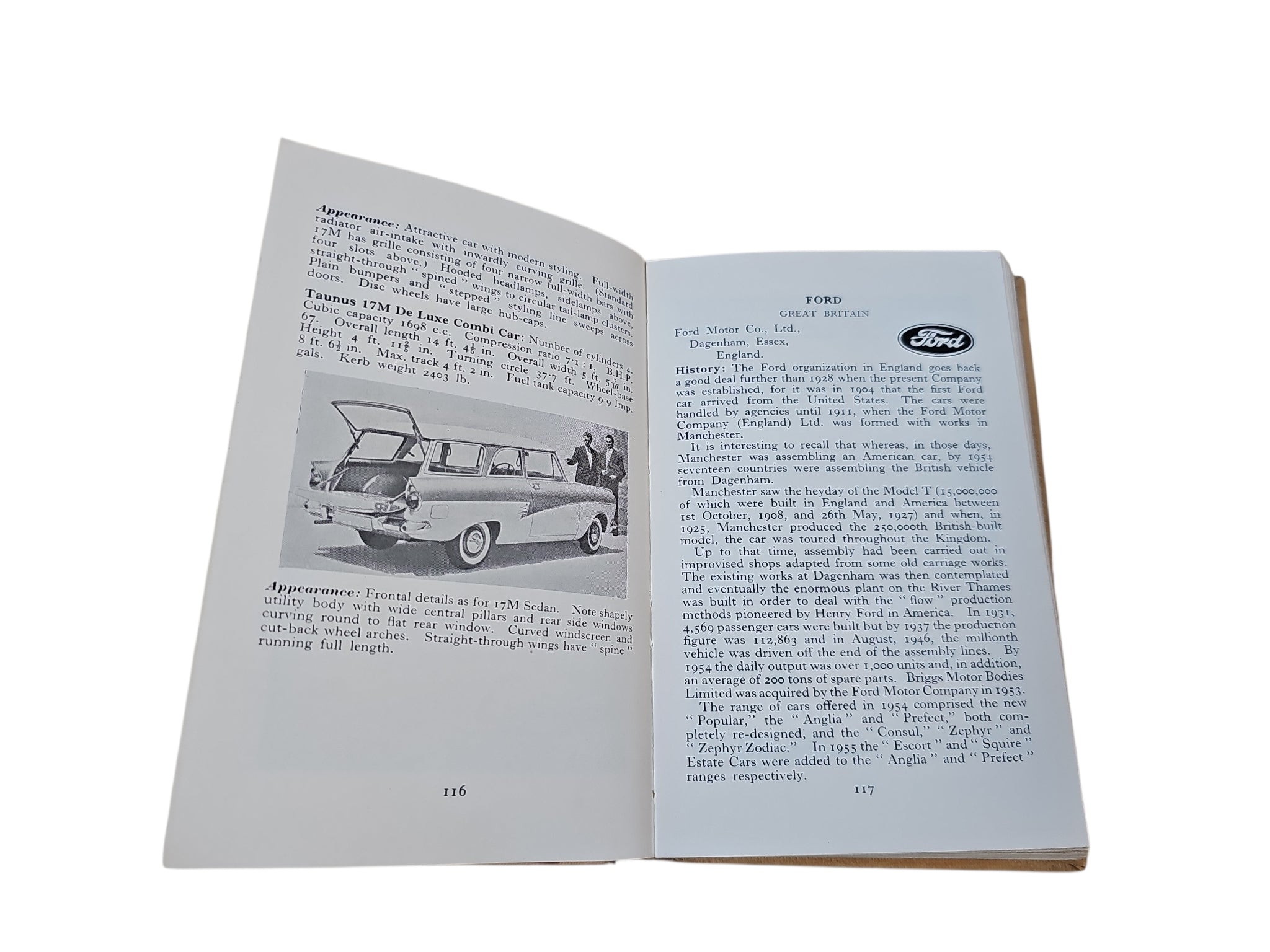 Open automobiles book with car line drawings and text describing models
