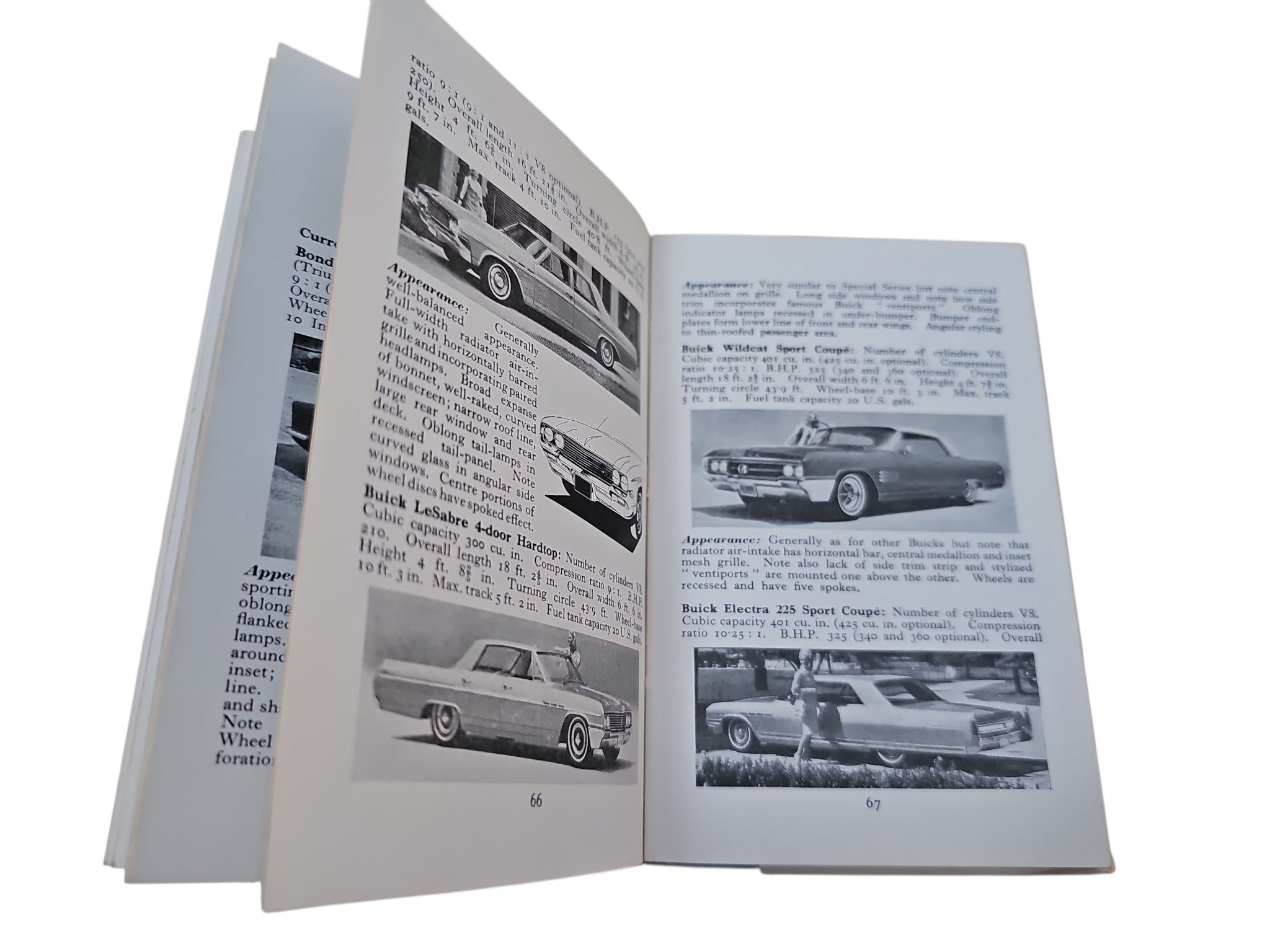 Opened book with dense car text columns and small vehicle photos across pages