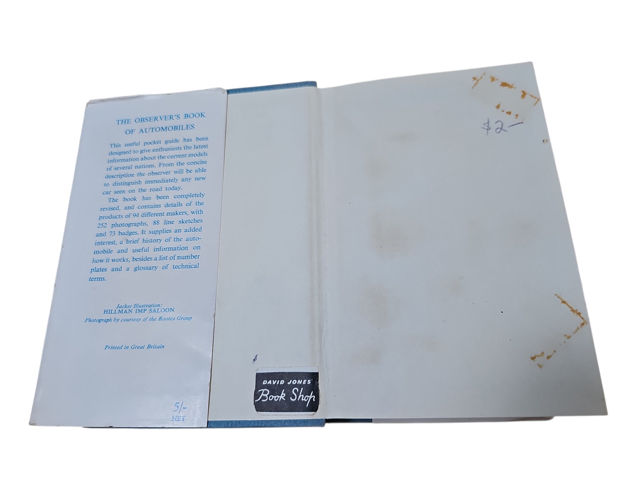 Opened Automobiles book showing printed page on left and mostly blank page on right