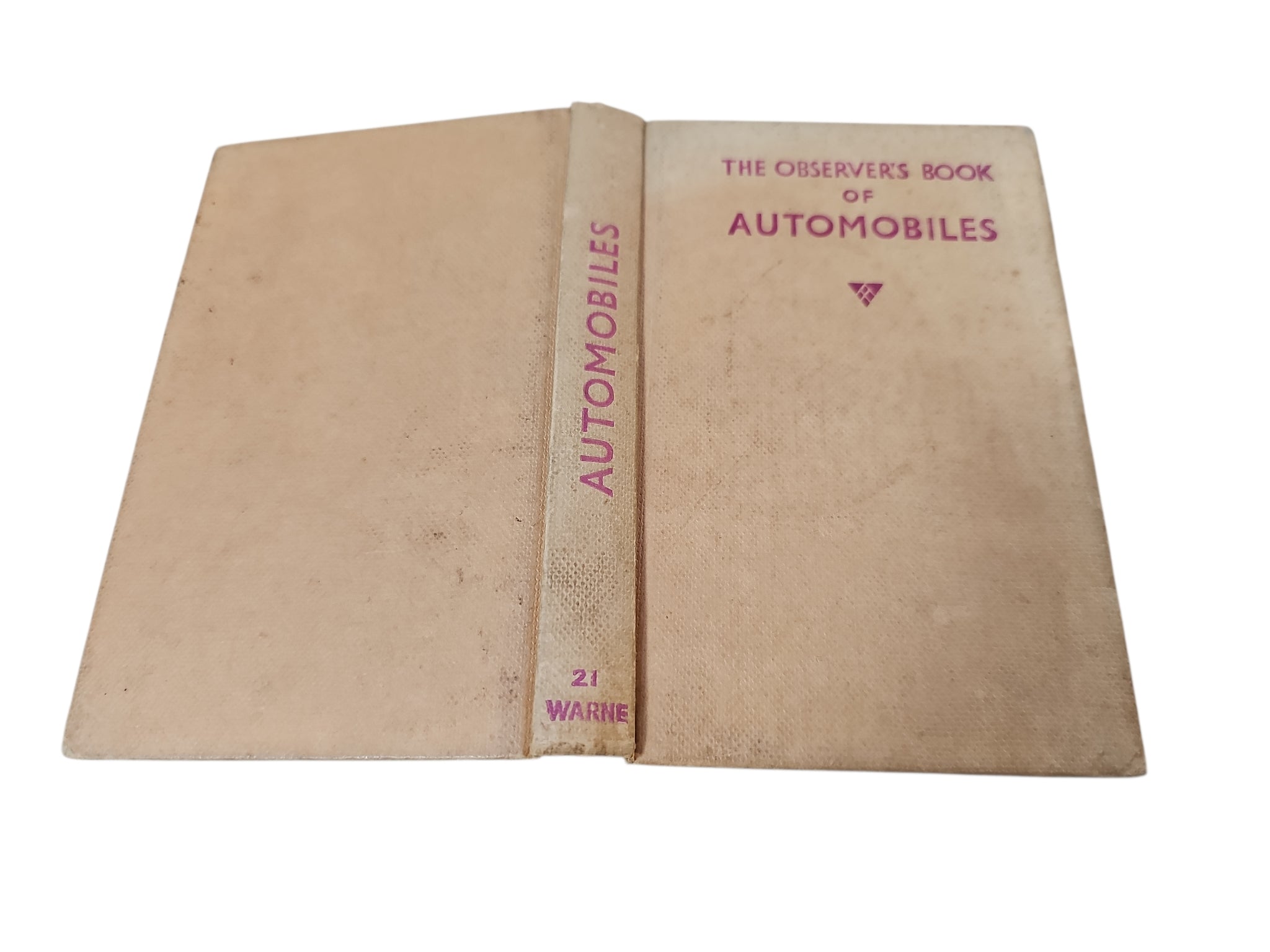Open automobiles book with vintage car photo and captioned diagrams