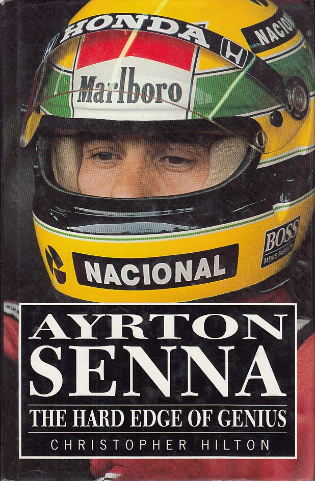 Paperback book cover close-up with racing helmet and bold "Ayrton Senna" text