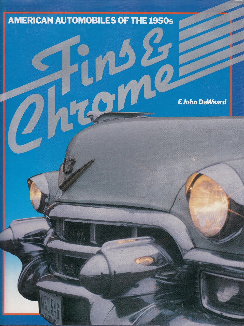 Automotive history book with blue cover, white Fins & Chrome title and classic car
