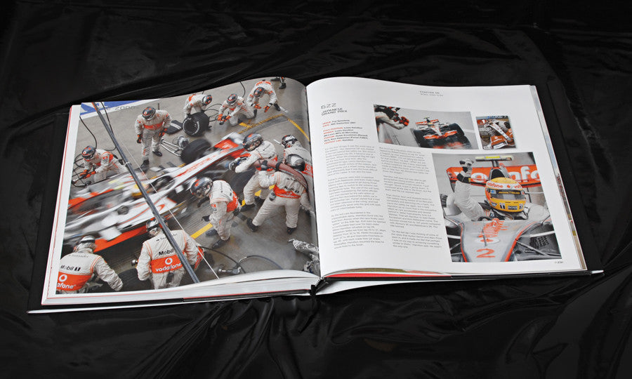 Open racing book with action photo spread and article text on facing pages
