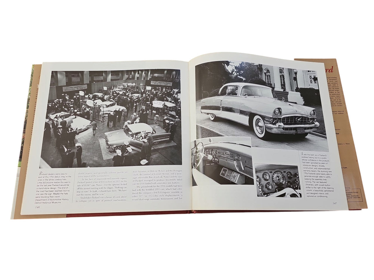 Packard hardcover book open spread with black-and-white car photos and captions