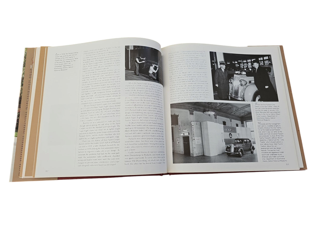 Packard hardcover book open spread with black-and-white interior photos and dense text