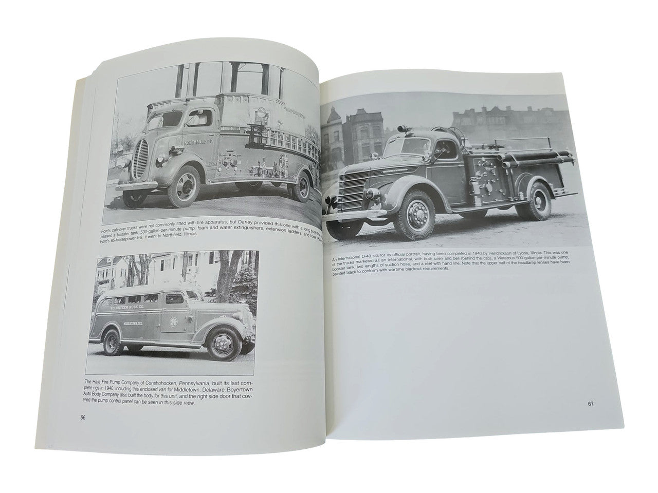 Fire engines guidebook open to black-and-white fire truck photos on both pages