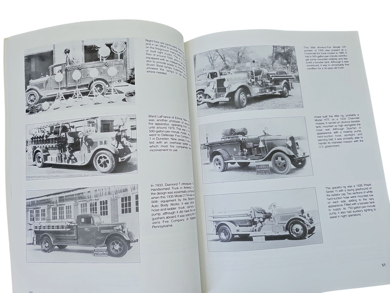 Fire engines guidebook open to black-and-white fire engine photos with captions