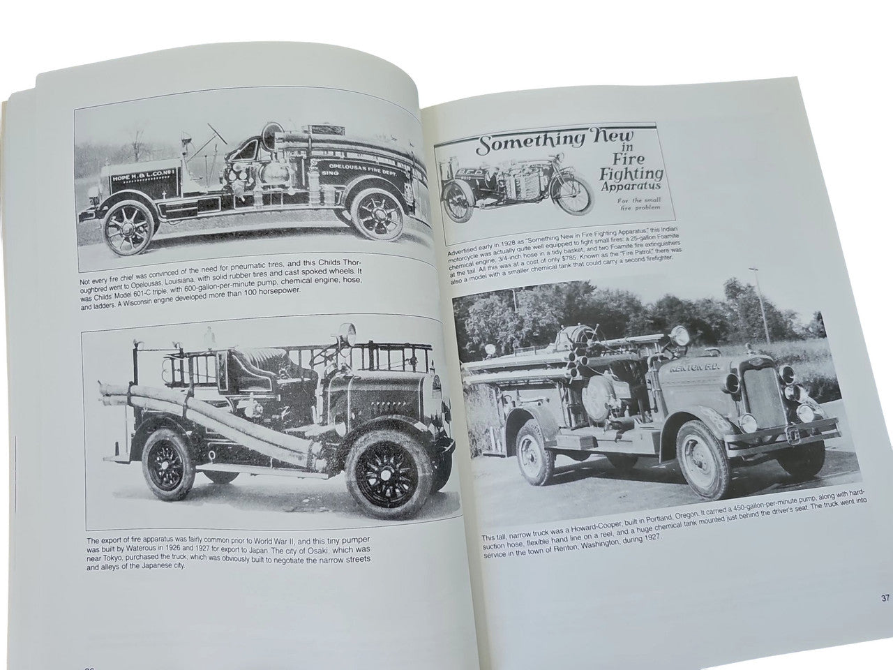 Fire engines guidebook open to black-and-white fire engine photos with headings