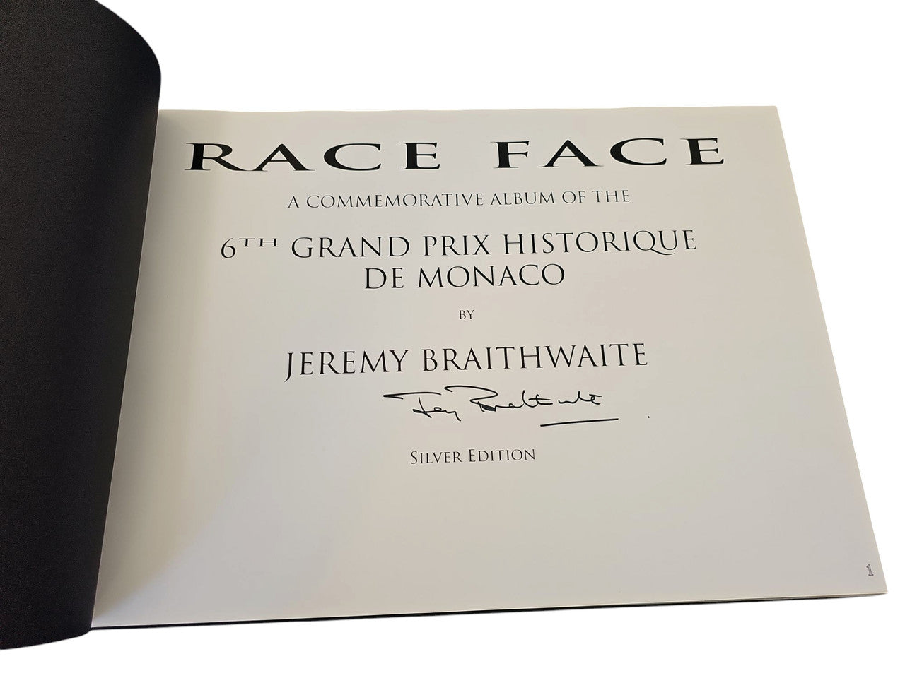 Signed commemorative race album page, cream with Race Face title and Jeremy Braithwaite