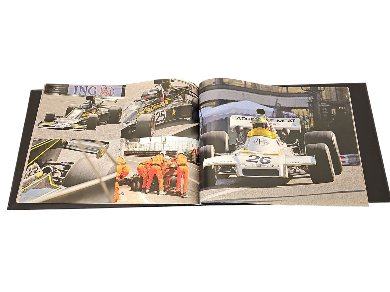 Commemorative race photo album spread with historic race car action photos