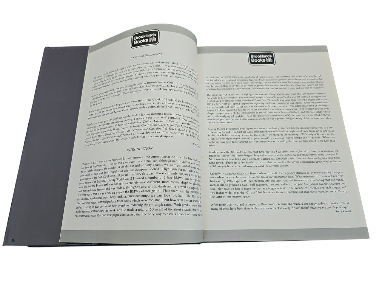 Open hardcover car book showing two cream pages filled with text