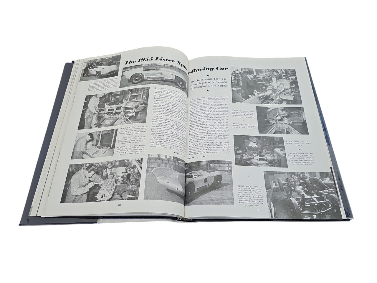 Open hardcover car book with multiple car photos and captioned text pages