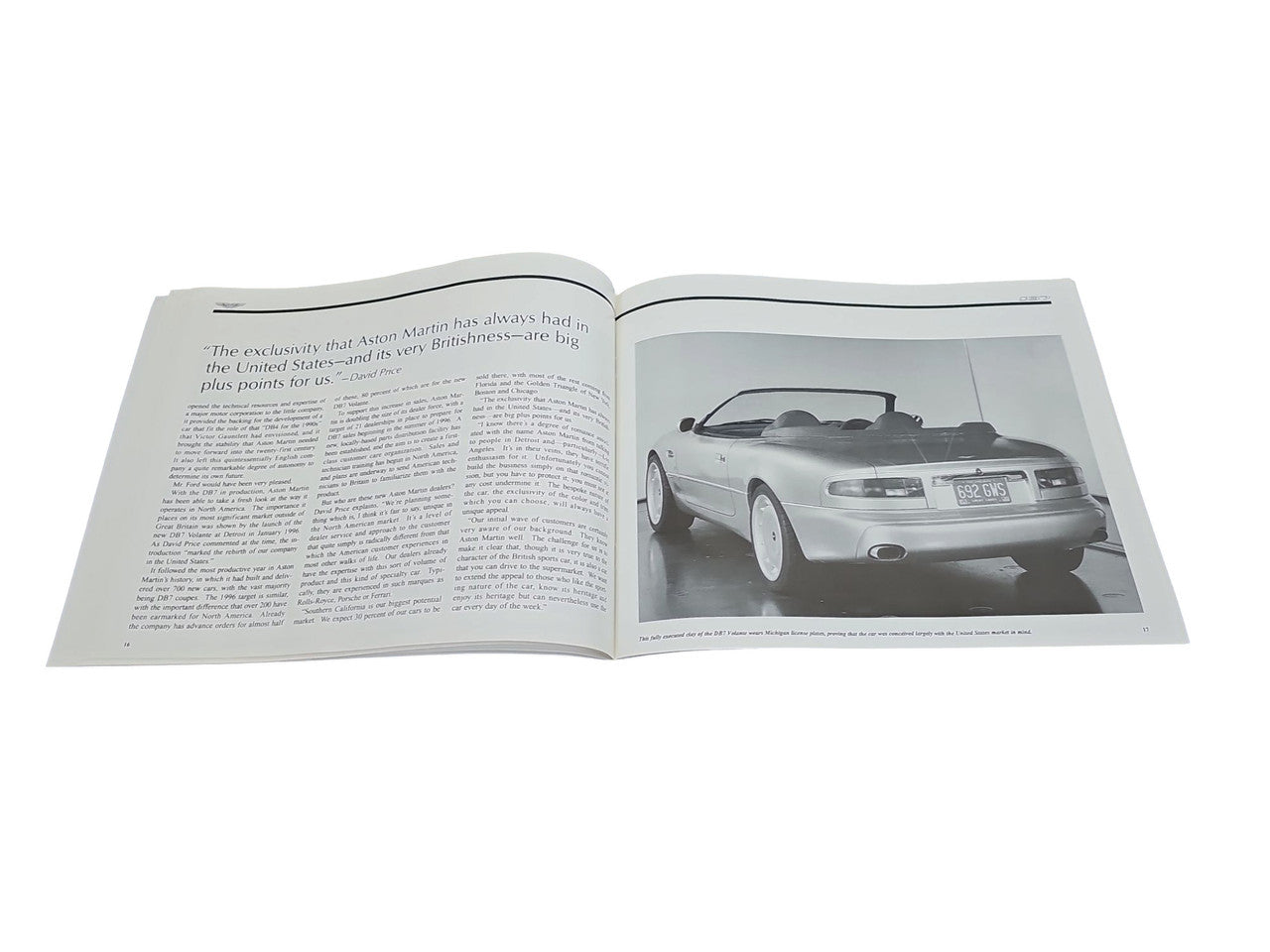 Open book spread with car photo on the right and dense text on the left
