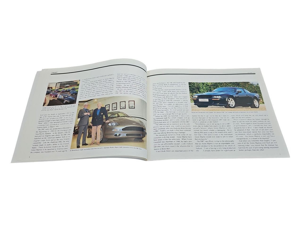 Automobile photo book open to two-page spread with car and portrait photos