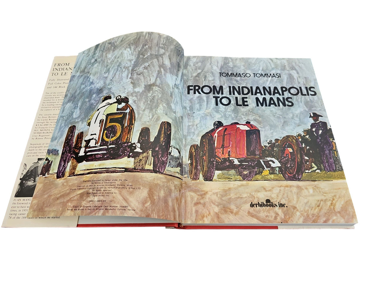 Open hardcover motorsport book with illustrated cover art and racing title text