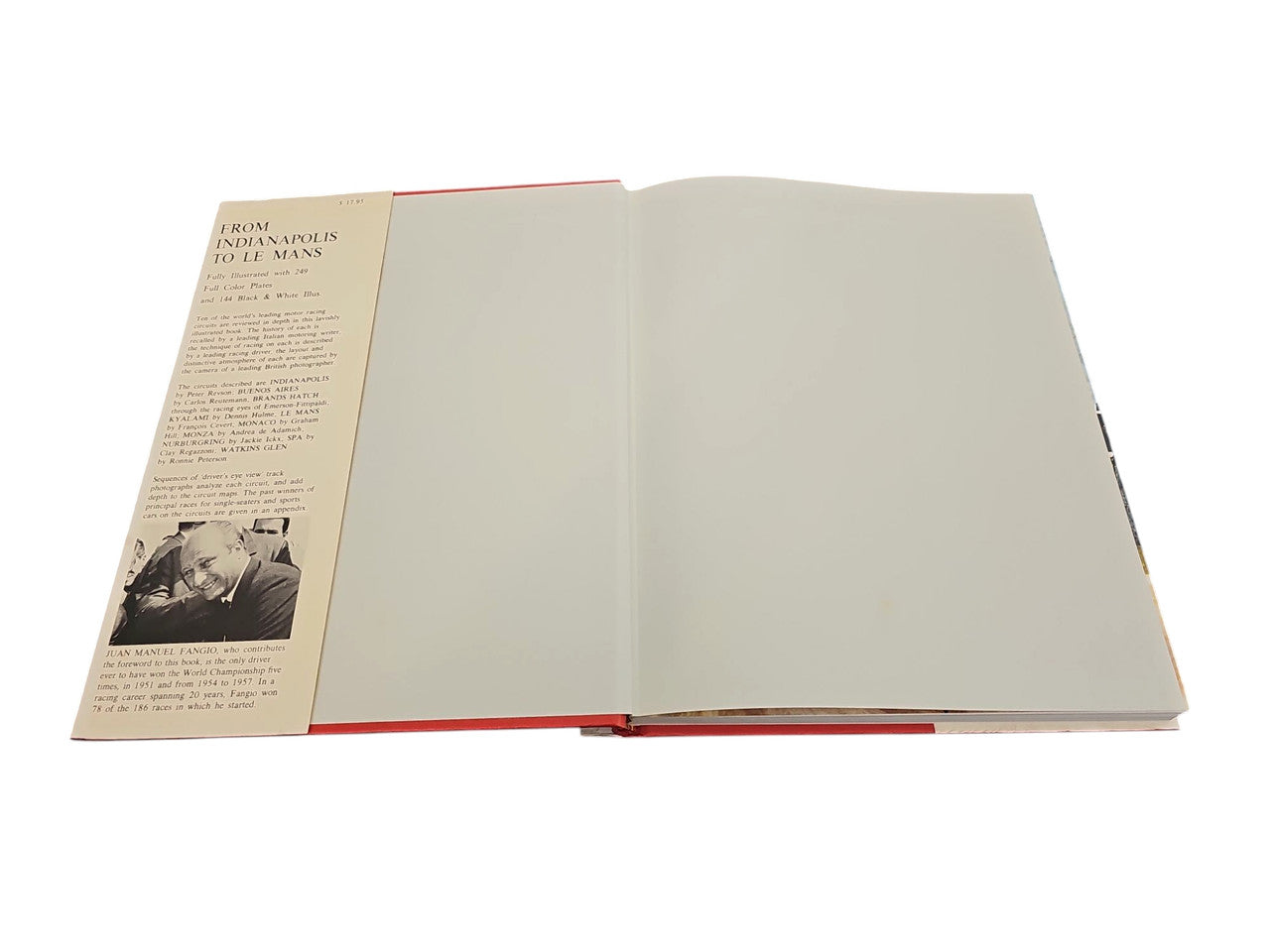Opened book with blank cream pages and a red spine accent; paperback style.