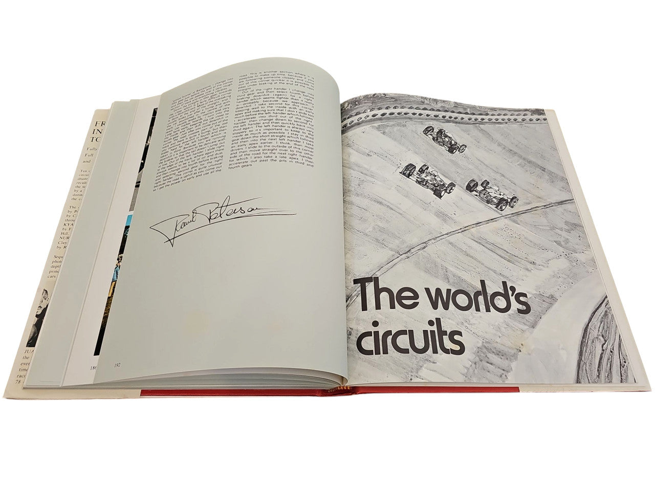 Open book spread with captioned photo on the right and signature on the left page