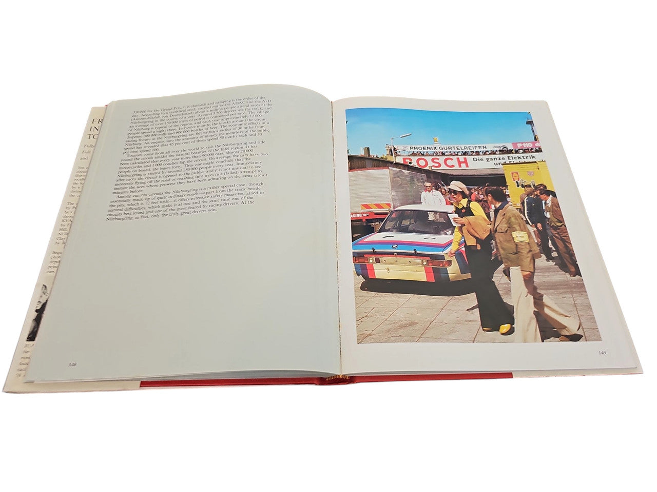 Opened book with one full-color photo page beside a page of printed text.
